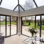 A {large} living room with a {glass} roof in Tetbury.